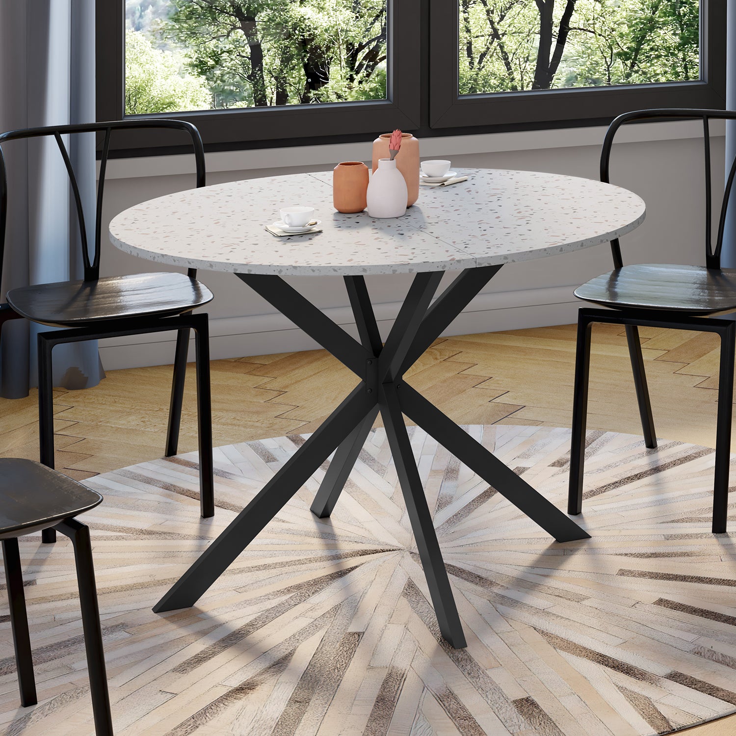 Table repas Soline 110cm plateau rond effet Terrazzo et pieds croisés noirs