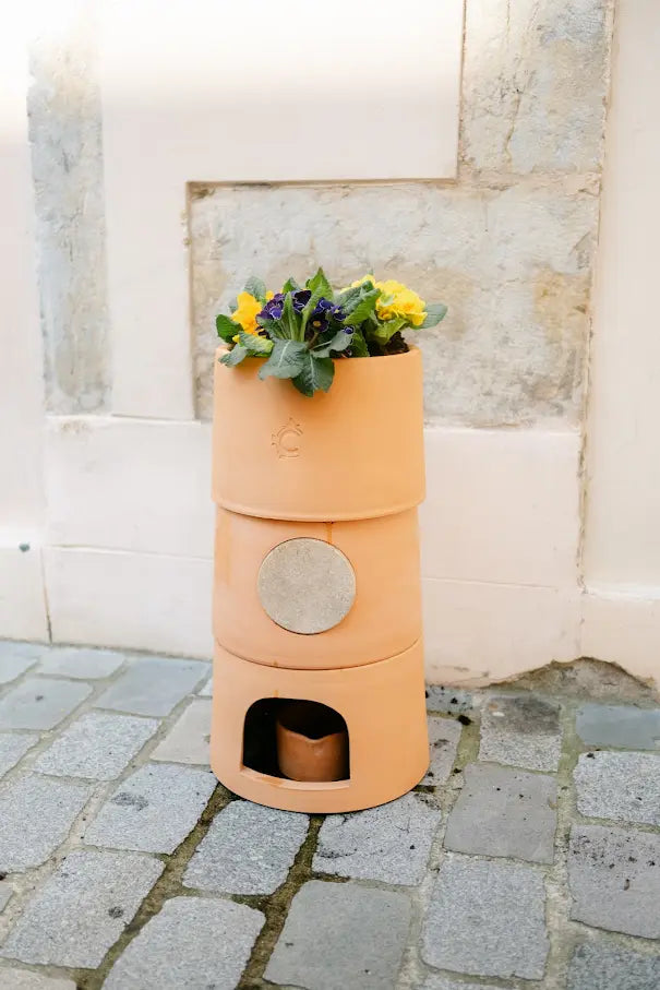 Pot de fleurs composteur