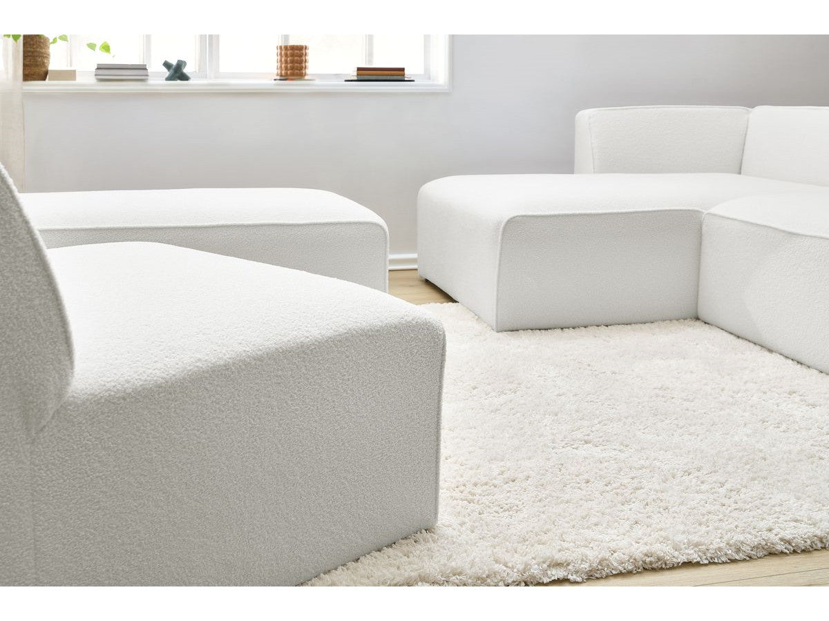 Canapé d'angle fixe modulable MEGEVE tissu bouclette avec 1 chauffeuse et 1 pouf - Angle gauche