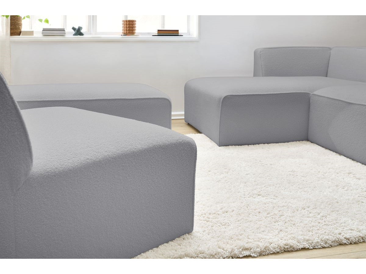Canapé d'angle fixe modulable MEGEVE tissu bouclette avec 1 chauffeuse et 1 pouf - Angle gauche