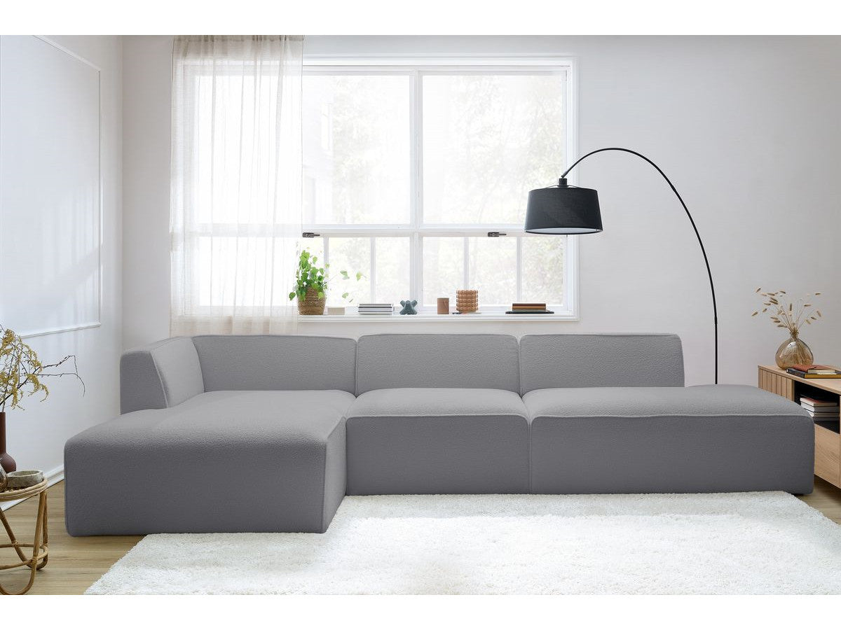 Canapé d'angle fixe modulable MEGEVE tissu bouclette avec 1 chauffeuse et 1 pouf - Angle gauche