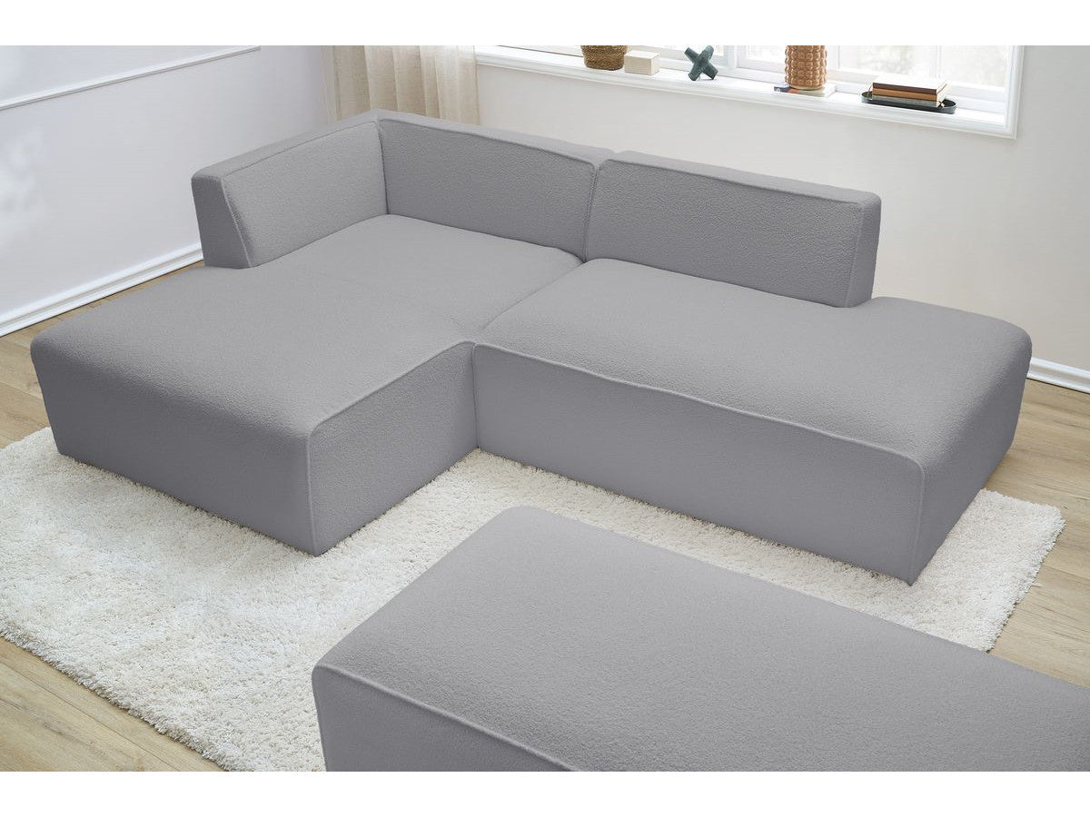 Canapé d'angle fixe modulable MEGEVE tissu bouclette avec pouf Angle gauche