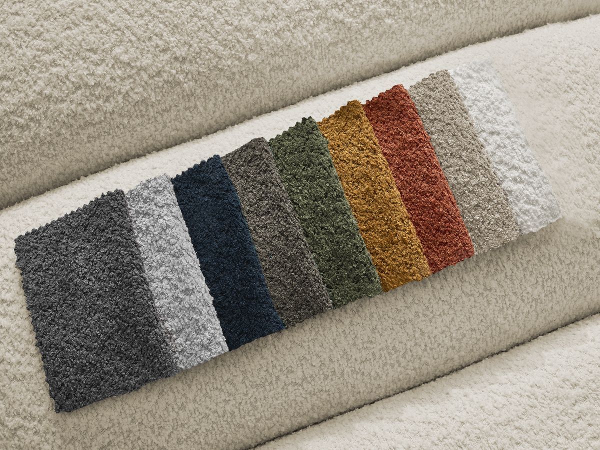 Canapé d'angle fixe TALIA tissu bouclette avec pouf - Angle gauche