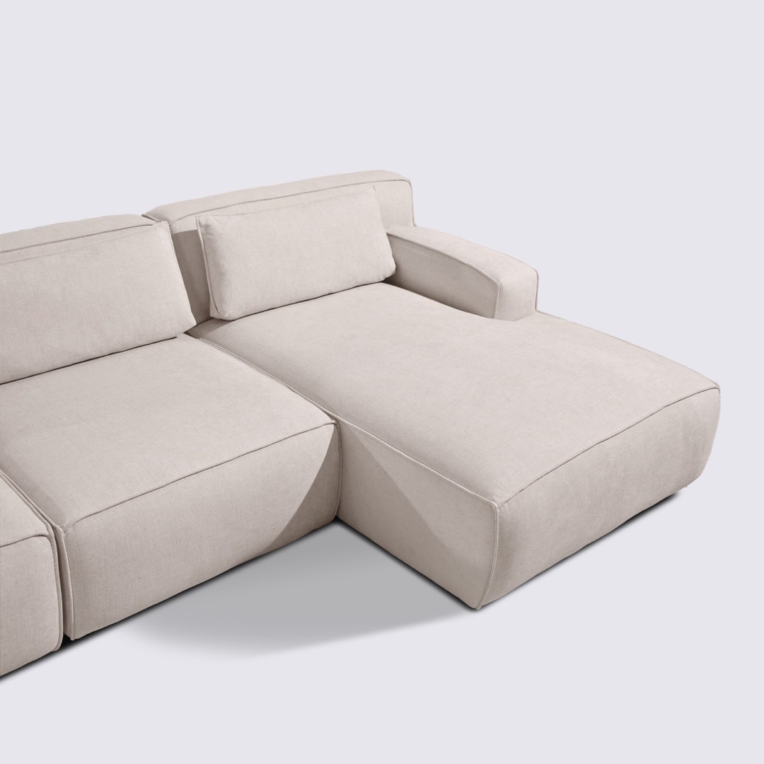 Canapé d'angle droit modulable 4 places en tissu crème – Lorenzo