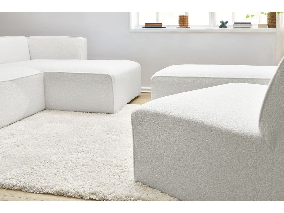 Canapé d'angle fixe modulable MEGEVE tissu bouclette avec 1 chauffeuse et 1 pouf - Angle droit