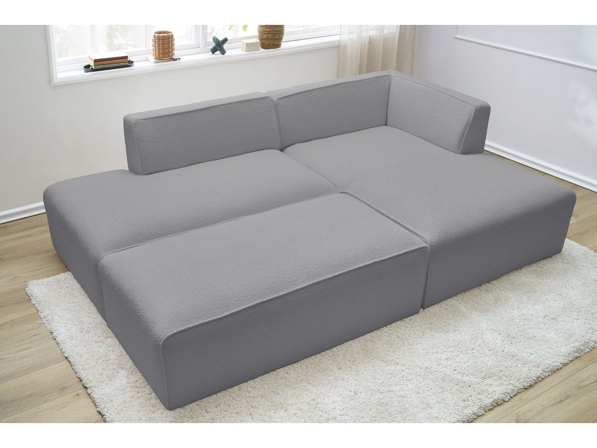 Canapé d'angle fixe modulable MEGEVE tissu bouclette avec pouf Angle droit
