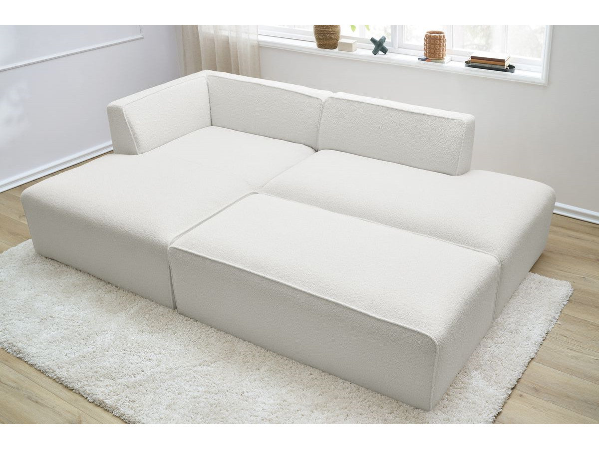 Canapé d'angle fixe modulable MEGEVE tissu bouclette avec pouf Angle gauche