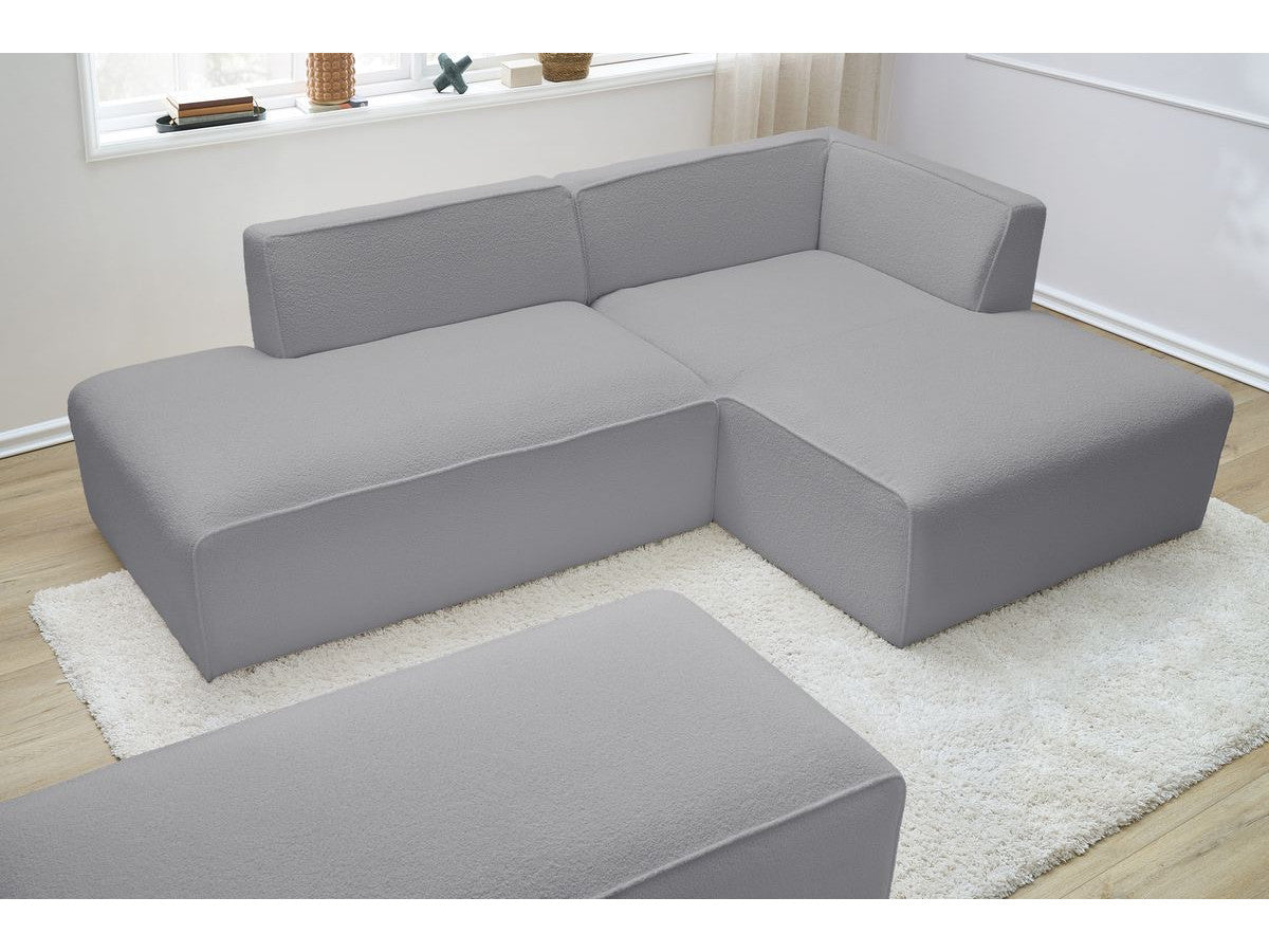 Canapé d'angle fixe modulable MEGEVE tissu bouclette avec pouf Angle droit