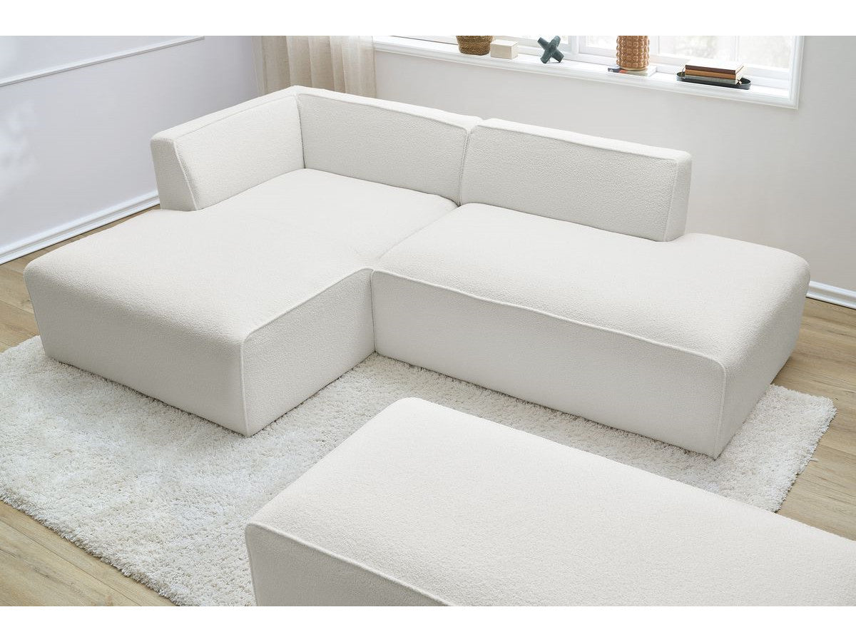 Canapé d'angle fixe modulable MEGEVE tissu bouclette avec pouf Angle gauche