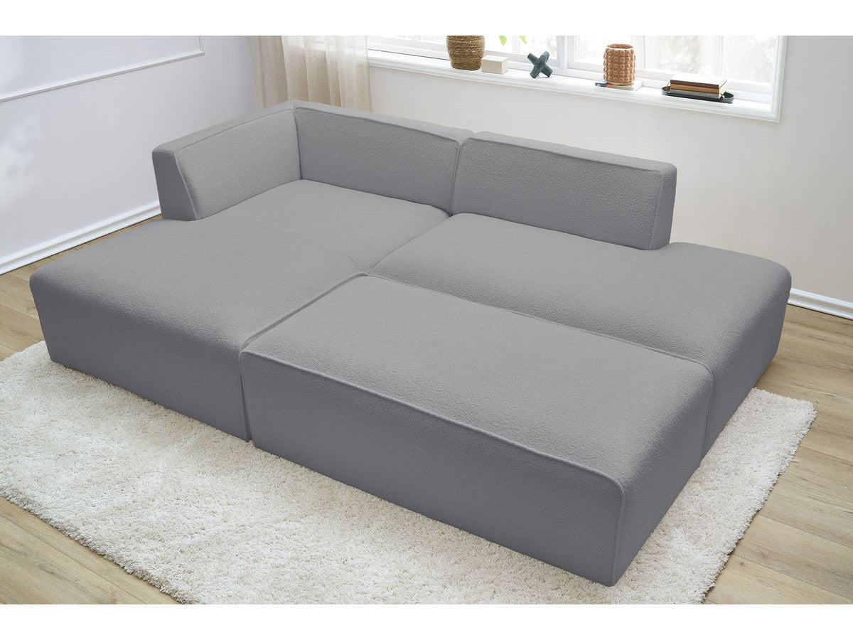 Canapé d'angle fixe modulable MEGEVE tissu bouclette avec pouf Angle gauche